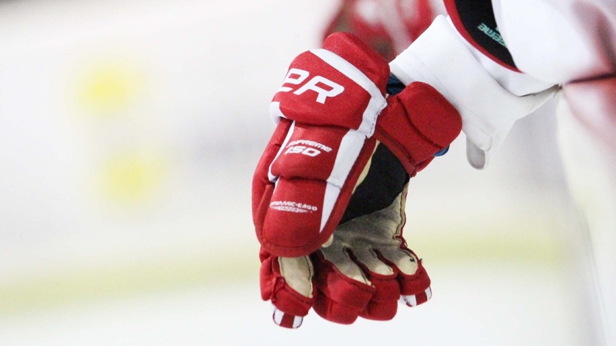 the player wears ice hockey gloves