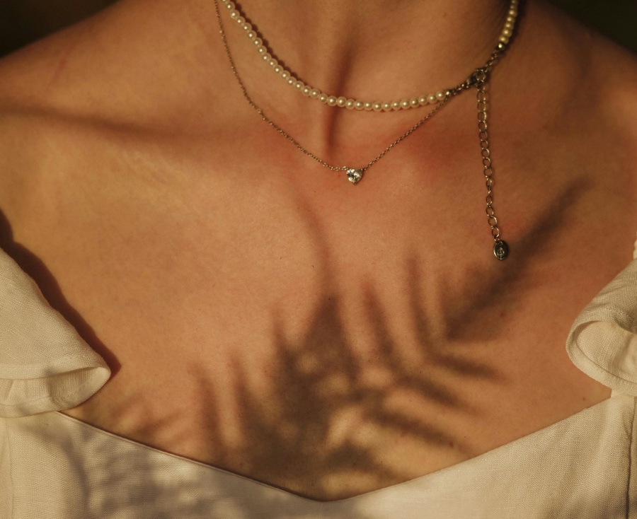 different necklaces on a woman